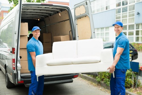 Office relocation planning in Toscotland with moving team and packed boxes