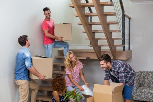 Local furniture pick-up service loading mixed bulky items for removal