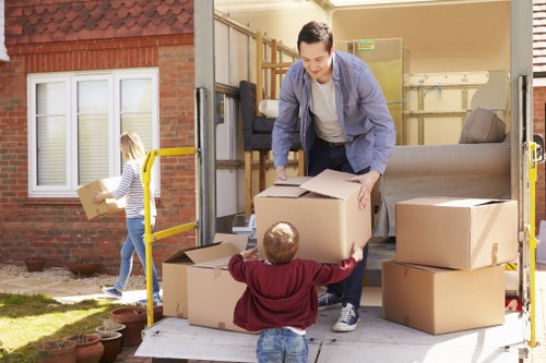 Removal team preparing boxes and furniture safely during a move