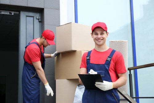 Mover handling furniture with care during a removal service