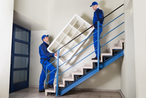 Movers handling boxes and furniture for a property relocation
