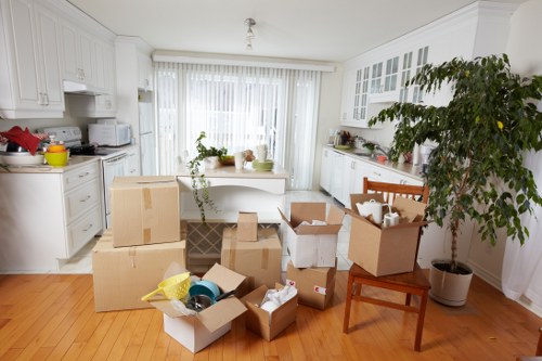 Careful loading of household items by a local removals crew