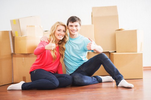 Team member wearing PPE while moving items carefully