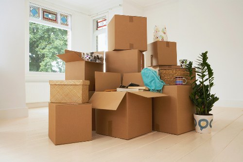 Packed boxes and furniture ready for removal transport